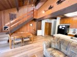 Mammoth Condo Rental Arrowhead 4: Living room, dining room, access to private deck, stairs to the loft